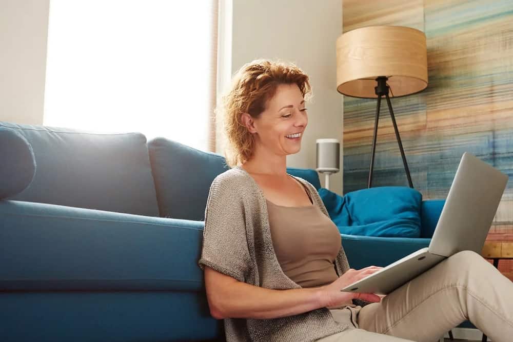Business Ideas for Menopausal women. Women sitting with a laptop.