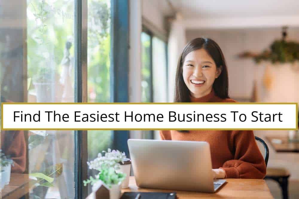 Easiest Home Business. Woman at desk with laptop smiling at the camera.